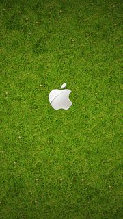 芝生に白いAppleロゴ